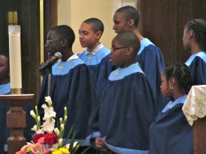 Members of the children’s choir sing hymns that they chose for the first-ever Young Adult Ministry Revival hosted by Our Lady of Light parish in St. Albans. (Photo by Jim Mancari)