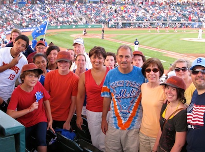 Parishioners from Immaculate Heart of Mary, Windsor Terrace, joined Father Robert Adamo, pastor, right, at MCU Park in Coney Island on “Family Fun Night” to catch the Brooklyn Cyclones take on the Hudson Valley Renegades July 17. The Cyclones hosted Houses of Worship Faith Night in which IHM received discounted tickets. The parish supported the team by wearing powder blue Cyclones baseball caps. Though the Cyclones lost 4-1, it was a fun night out for the parish. (Photo by Jim Mancari)