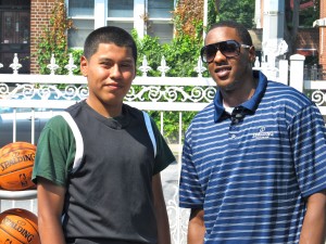 Spalding contest winner Carlos Mayorga, left, is pictured with Miami Heat guard Mario Chalmers. (Photo by Jim Mancari)