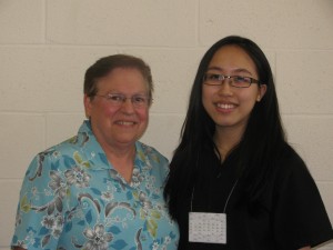 Sister Thomasine Stagnitta, C.S.J., principal of Bishop Kearney, left, poses with 2013 National Merit Scholar semi-finalist Billie Wei, a senior at Kearney.