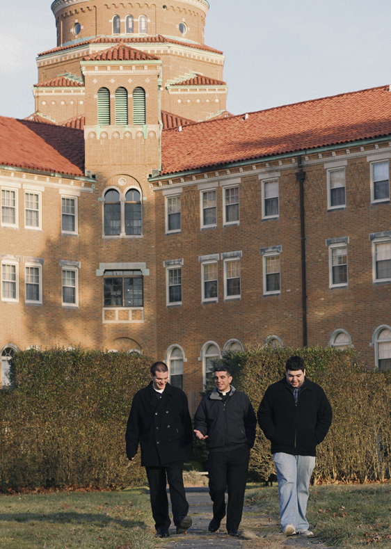 Father Joseph Fonti, center, walks with Christopher Bethge, left, and Ralph Edel, seminarians for the Diocese of Brooklyn, at Immaculate Conception Seminary in Huntington, L.I. Bethge and Edel were among the more than 50 seminarians from St. Joseph’s Seminary in Yonkers, attending a four-day retreat in Huntington. National Vocation Awareness Week is Jan. 13-19.