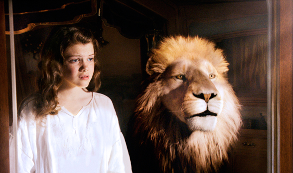 Georgie Henley is pictured with a lion named Aslan, voiced by Catholic actor Liam Neeson, in the 2010 movie The Chronicles of Narnia: The Voyage of the Dawn Treader.