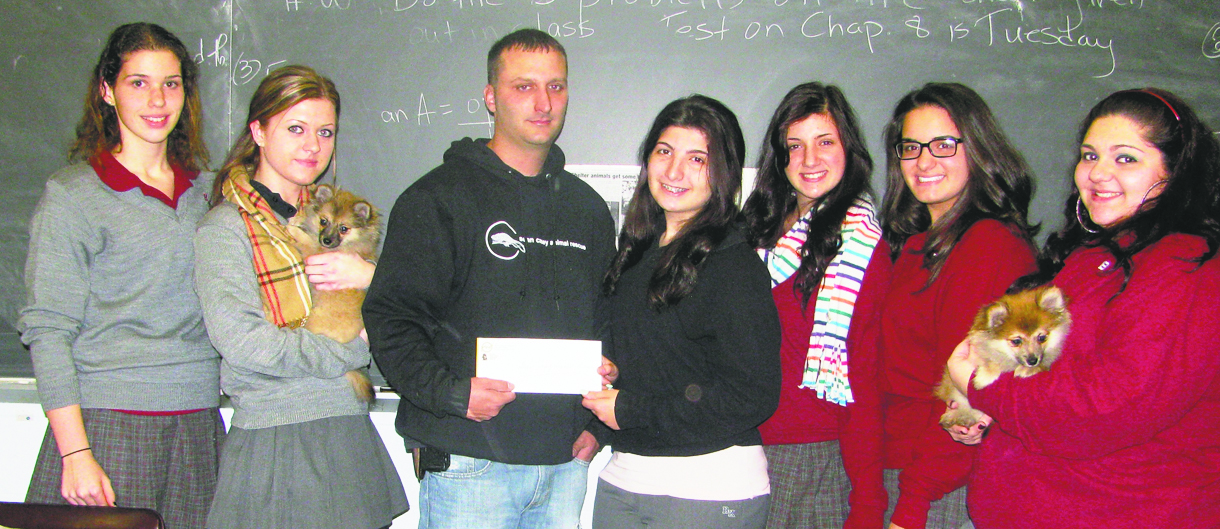 Representatives from two of Bishop Kearney clubs, God’s Earth and Creatures and the Stage Crew, are seen presenting a check to Sean Casey. From left to right are Amanda Degand, Raimonda Dumpyte, Ariana Lamberto, Michelle Galante, Nancy Marangelli and Nicole Loretta. 