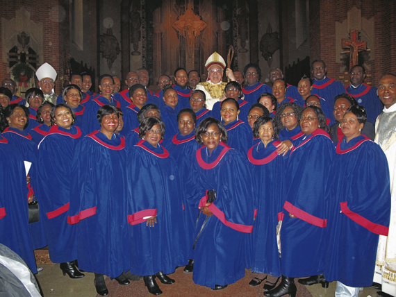 Bishops DiMarzio and Guy Sansaricq and Father Jean Delva are surrounded by members of the Haitian diocesan choir.