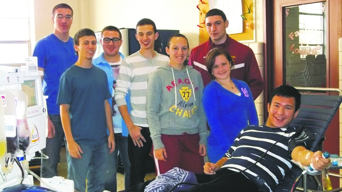 Christ the King students were on hand as their fellow classmate, Richard Cantorel, donated blood. Standing in the back row, from left, are: Justin Engstler, Austin Piazza, Frank Provenzano and Ricky Wahmann. Standing, bottom row, from left, are Benito Gambino, Destiny Marino and Casey Bartek.