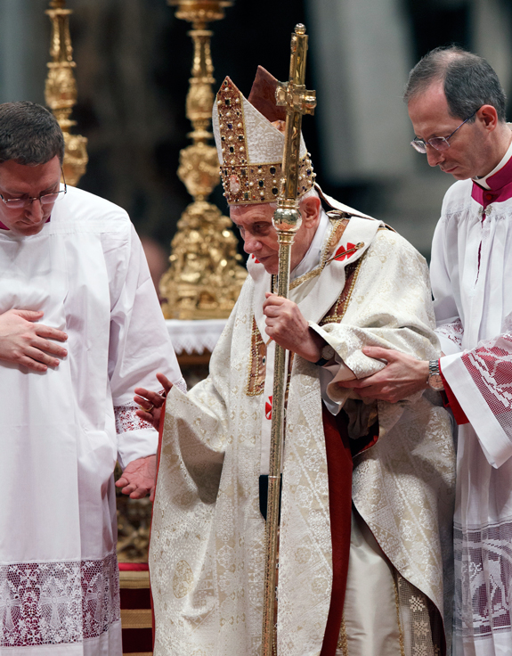 Aides assist Pope Benedict XVI as he celebrates Mass marking the feast of the Presentation of the Lord and World Day for Consecrated Life in St. Peter’s Basilica at the Vatican Feb. 2. The pope announced Feb. 11 that he will resign at the end of the month.