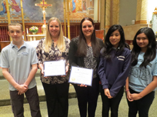 Last weekend, Colleen Ashton and Mary Ashton Buckley accepted NCEA Distinguished Graduates Awards at St. Sebastian parish, Woodside. They were recognized for their contributions to parish and school through the fundraising they do in memory of their brother, Thomas Ashton, who died as a result of the Sept. 11, 2001 attacks. Emmett Galligan, Class of 2013 and winner of the Thomas Ashton Memorial Scholarship to Archbishop Molloy H.S., presented the award to Colleen Ashton and Mary Ashton Buckley, along with members of the eighth-grade Elizabeth Ann Seton Service Volunteers, Michelle David and Allysa Roque. (Photo courtesy St. Sebastian School) 