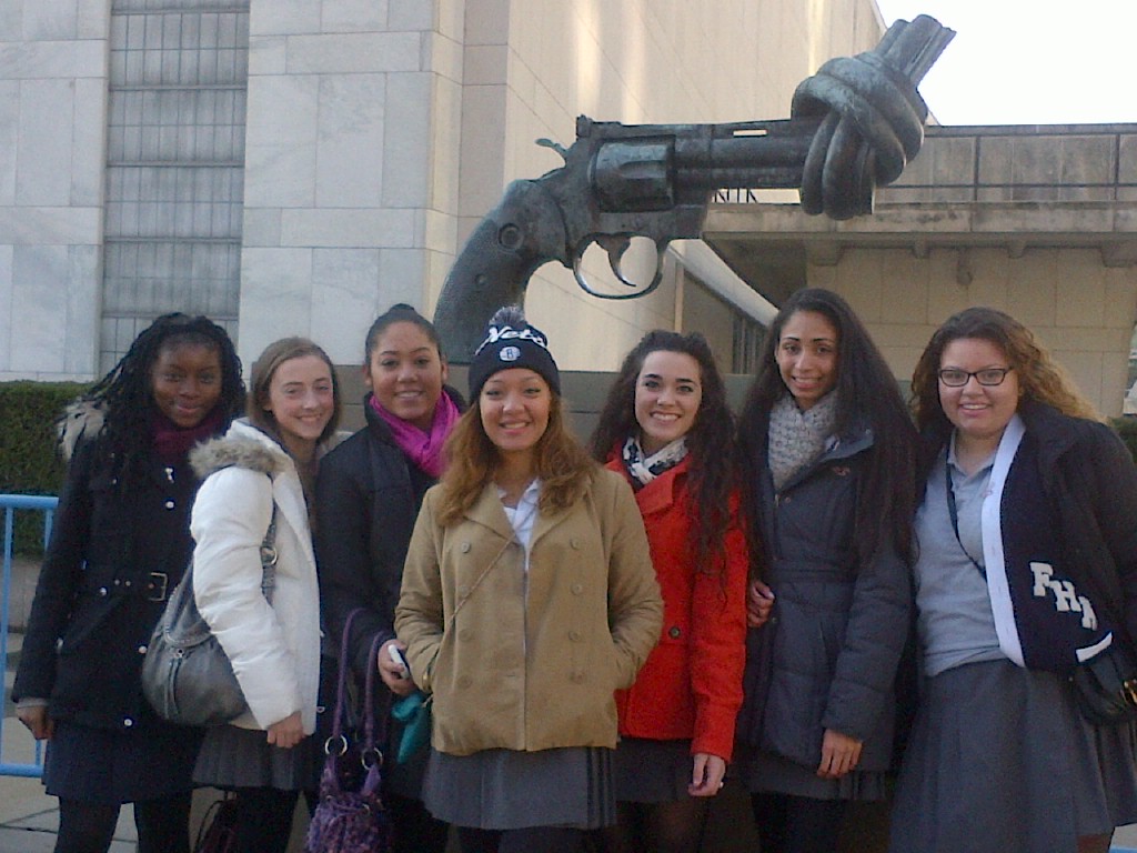 Fontbonne Hall Academy students, from left, Ugonna Nwabueze, Michelle Gubitosi, Christina Vazquez-Rivera, Jazmin Rivera, Cathleen Giordano, Alexia Mitey and Megan Rosario capture their trip to the United Nations with a photo in front of a sculpture which speaks to the end of gun violence in the world.