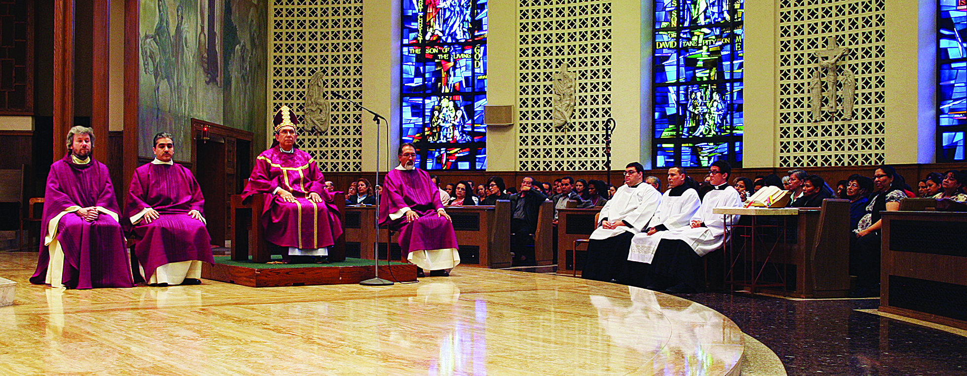 Bishop Cisneros and Father Gillespie are assisted at the altar by Deacon Franklin Munoz and Deacon Ruben Siavichay. 