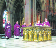 Bishop Nicholas DiMarzio leads a concelebrated Mass at Immaculate Conception Cathedral in the state capital.
