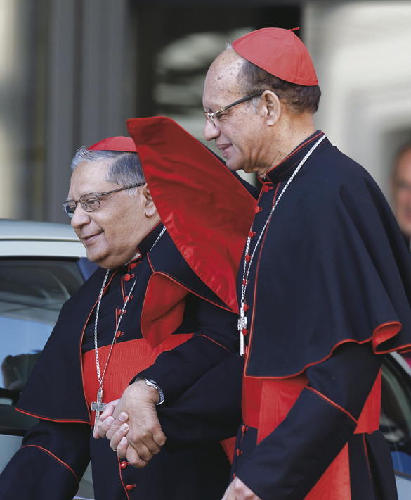 Cardinal Oswald Gracias of Mumbai, India, assists Cardinal Ivan Dias of Mumbai.