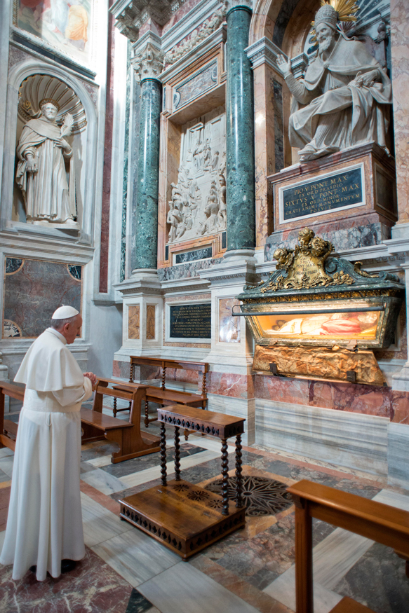 Newly elected Pope Francis, Cardinal Jorge Mario Bergoglio of Argentina, prays at the tomb of Pope St. Pius V in a chapel of the Basilica of St. Mary Major in Rome March 14.
