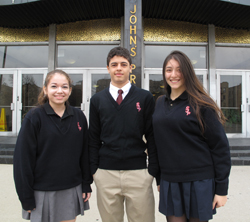 Students of Argentinian heritage, Merlina Rodas, Andrew Fernandez and Julia Baez, stand proudly in front of their school, St. John’s Prep, Astoria. 