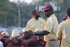 Tyree Allison instructs his players at Christ the King football practice in fall 2012. (Photo courtesy Tyree Alllison)