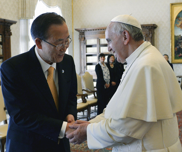 Pope Francis greets U.N. Secretary-General Ban Ki-moon during a meeting at the Vatican April 9.