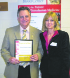 Deacon Richard Gilligan, vicariate representative for Queens, left, with Dianne Robinson, manager of business development for NYBC Queens.