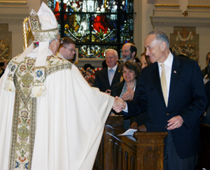 Bishop DiMarzio greets Sen. Charles Schumer at the Migration Day Mass celebrated at St. James Cathedral-Basilica in Downtown Brooklyn. Photo © Marie Elena Giossi