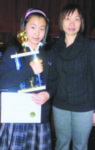 Intermediate Math Bee winner Kaiqi Liang and her mother.
