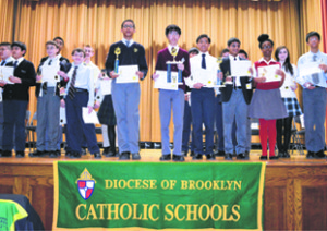 Junior High winners Andrew Johnson, Brian Lai and Marc Julien Calza, surrounded by fellow participants. Photos courtesy of the Superintendent of Catholic Schools Office.