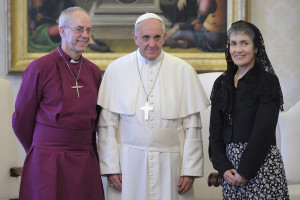 Pope Francis poses with Anglican Archbishop Justin Welby of Canterbury, England, and his wife, Caroline, during a private audience at the Vatican June 14. 