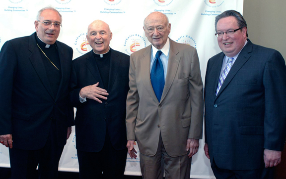 At a Catholic Charities function, from left, are Bishop Nicholas DiMarzio, Auxiliary Bishop Joseph M. Sullivan, Mayor Edward I. Koch and Robert Siebel, executive director of Catholic Charities, Brooklyn and Queens.