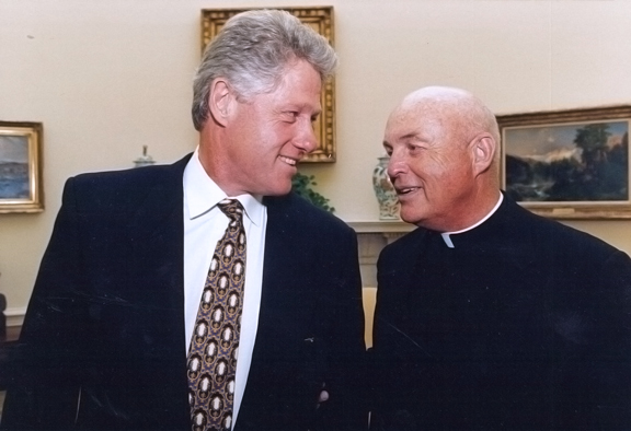 He is shown with President Bill Clinton at the White House