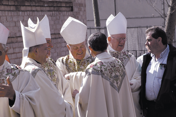 Bishop Sullivan chats with others bishops and Msgr. Otto L. Garcia outside St. James Cathedral.