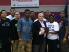 Dominic Murray's former teammates help Mrs. Melinda Murray present McClancy basketball coach Donald Kent with the Dominic A. Murray 21 Memorial Foundation's Coach of the Year Award.