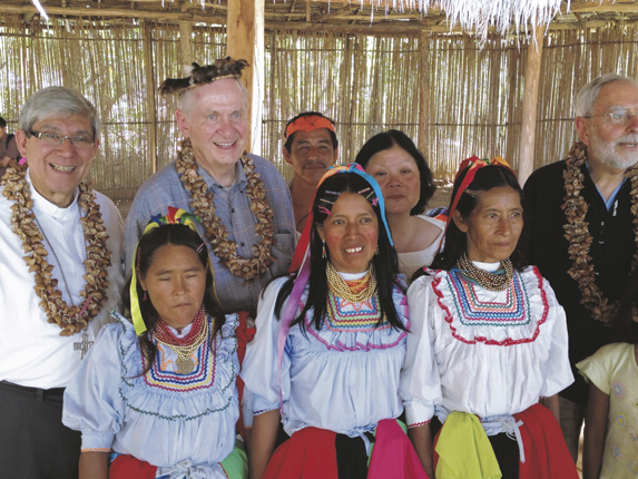  Bishop Octavio Cisneros, left, is joined by Bishops Richard Pates and Gerald Kicanas as they meet with members of an Amazonian indigenous community.