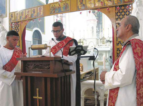 Joseph Armanious reads in English during a Coptic Mass at Resurrection Coptic Catholic Church, Park Slope, three days after his return from Egypt. 