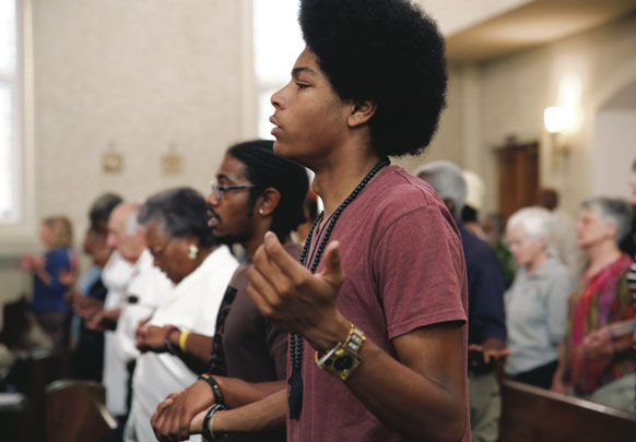 People gather for a special Mass marking the 50th anniversary of the March on Washington Aug. 24 at Holy Redeemer Catholic Church in Washington, D.C. The Mass was followed by a discussion on race, religion and the legacy of the 1963 civil rights march.