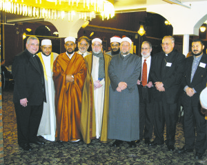 Bishop DiMarzio, right, and Msgr. Ronald Marino flank Islamic leaders at a Ramadan observance in Sunset Park.