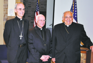 Bishop Nicholas DiMarzio, at right, introduces the new auxiliary bishops of the diocese, from left, then Bishops-elect Paul Sanchez and Raymond Chappetto, May, 2012.
