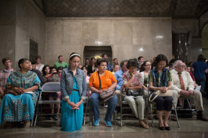 A woman kneels in prayer during a Mass for peace in Syria and the world Sept. 7 in the Crypt Church at the Basilica of the National Shrine of the Immaculate Conception in Washington. (CNS photo/Tyler Orsburn)
