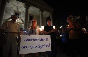 Activists hold candles as they participate in a Sept. 9 vigil in Glendale, Calif., against U.S. military intervention in Syria. (CNS photo/Mario Anzuoni, Reuters)