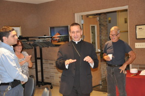 Bishop Frank Caggiano addresses diocesan employees during a reception in his honor at the Park Slope headquarters of the Brooklyn Diocese.