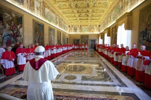 Pope Francis meets with cardinals at the Vatican Sept. 30 during the consistory in which he announced April 27, 2014 as the date for the canonization of Blesseds John XXIII and John Paul II. The Polish pontiff, who led the Catholic Church for 27 years and witnessed the fall of communism, and Pope John XXIII, who called the Second Vatican Council, will be declared saints in a single ceremony on Divine Mercy Sunday. 