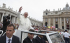 Pope Francis greets the crowd after celebrating a Mass for catechists in St. Peter’s Square at the Vatican Sept. 29.