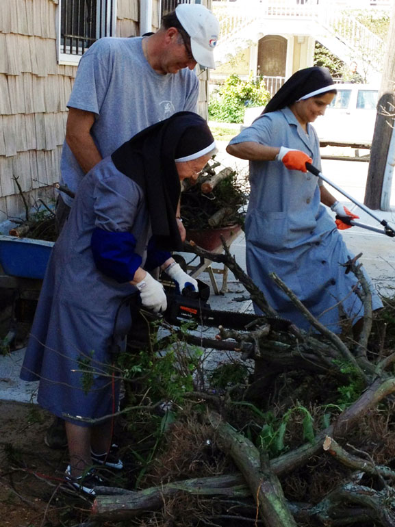 Volunteers, including these religious sisters, above, pitched in to help St. Camillus School get in good shape for the new school year. 