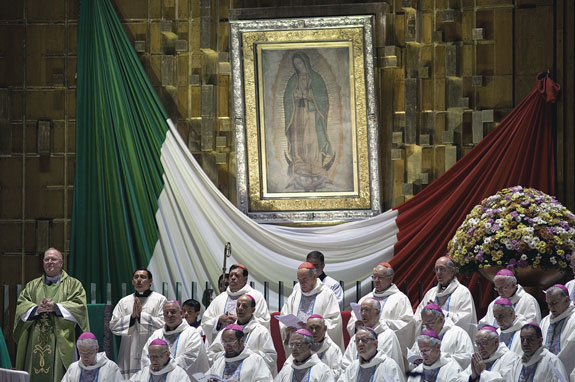 New York Cardinal Timothy M. Dolan, left, celebrates Mass alongside other prelates at the Basilica of Our Lady of Guadalupe in Mexico City Nov. 17. Bishops and church leaders from the Americas gathered Nov. 16-19 at the basilica to discuss the new evangelization in the Americas. 