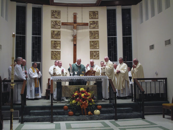 Bishop Nicholas DiMarzio was the main celebrant of the Mass of installation for the new pastor of Blessed Trinity parish, Breezy Point, Father Peter Rayder, seen to the bishop’s left.