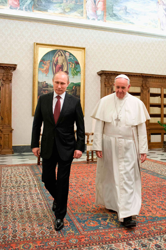 Pope Francis walks with Russian President Vladimir Putin during a private audience at the Vatican Nov. 25.  See story on Page 3. CNS photo/L'Osservatore Romano via Reuters