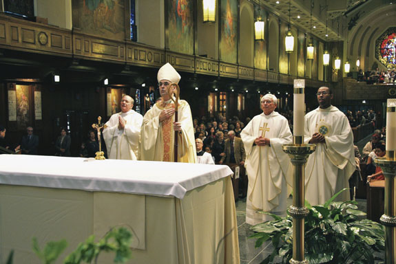 Auxiliary Bishop Paul Sanchez was the main celebrant of the Mass at St. Andrew Avellino Church, Flushing, to honor its patronal feast day. Concelebrants included, from left, Father Joseph Holcomb, pastor, Msgr. Michael Brennan and Father Rodnev Lapommeray. The parish is currently observing its 100th year.