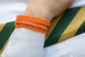 Holy Cross H.S., Flushing, has begun an anti-bullying campaign, featuring orange "Stop Bullying" bracelets. (Photo courtesy Andrew D'Angelo)