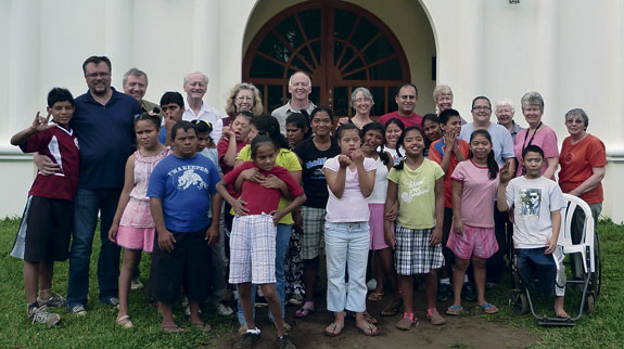 He led a group of missioners from Queens on a weeklong mission of service to Mustard Seed Communities in the  Latin American country. The group is pictured above with some of the locals with whom they visited.