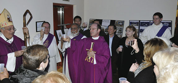 Msgr. Sean Ogle leads a toast to Bishop DiMarzio’s 10th anniversary as bishop of Brooklyn.