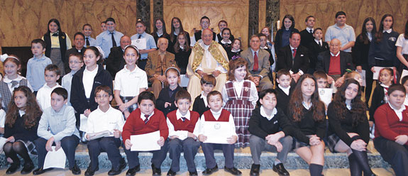 The full group of winners poses with Bishop Nicholas DiMarzio and members of the congress.