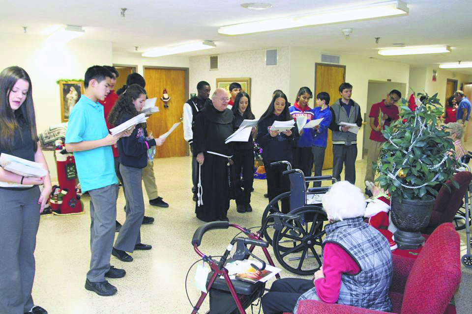 The Franciscan Youth Ministry from St. Francis Prep, Fresh Meadows, brought the Christmas spirit to the elderly at the Queen of Peace Residence, a nursing home operated by the Little Sisters of the Poor in Queens Village. They sang Christmas carols, delivered cards and letters and visited the residents in their rooms. 
