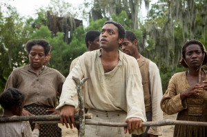 Chiwetel Ejiofor, center, stars in the movie “12 Years a Slave.