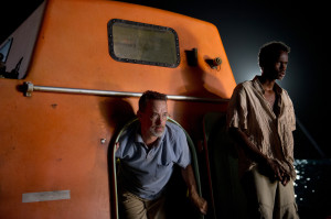 Tom Hanks, left, and Barkhad Abdirahman in a scene from “Captain Phillips.”